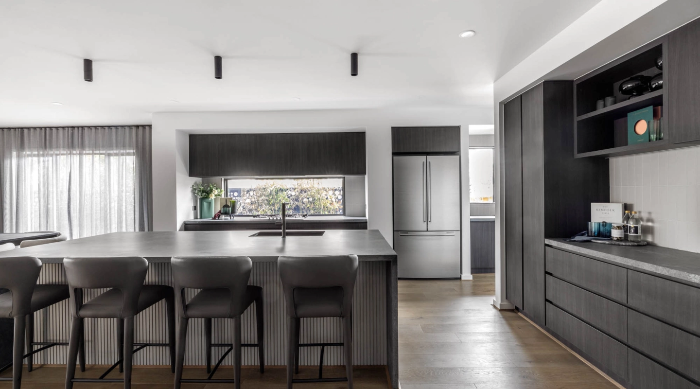 monochromatic timber dark tone kitchen with wood cladding built inside the island bench at silverton 45